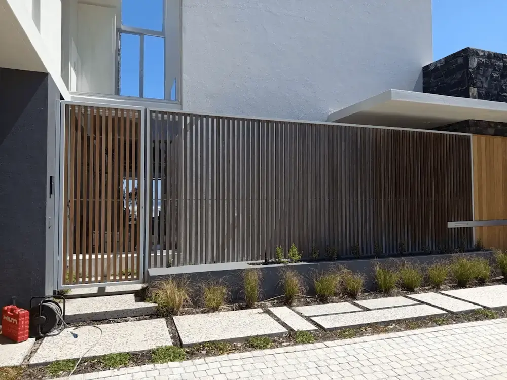Contemporary steel gate and fence system by Sterianos