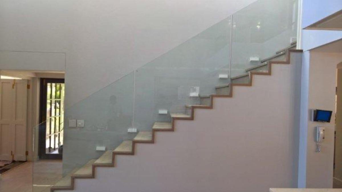 Frameless glass balustrade alongside staircase, Cape Town